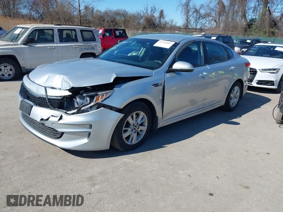 2016 Kia Optima LX with VIN 5XXGT4L37GG084538, listed as a IAAI auction lot 41784807 with 128,928 mi miles. Bid and sale history available at carsss.com. Image 2.
