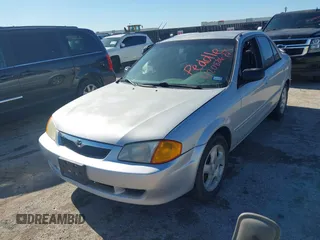 2000 Mazda Protege ES with VIN JM1BJ2213Y0284890, listed as a IAAI auction lot 42088671 with 215,104 mi miles and . Bid and sale history available at DreamBid. Image 2.