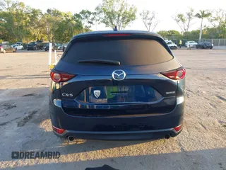 2021 Mazda CX-5 Touring with VIN JM3KFACM2M0450340, listed as a IAAI auction lot 42059613 with 38,960 mi miles and . Bid and sale history available at carsss.com. Image 16.