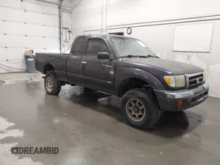 1999 Toyota Tacoma with VIN 4TAWM72N5XZ433296, listed as a IAAI auction lot 42595432 with 233,075 mi miles and . Bid and sale history available at DreamBid. Image 1.