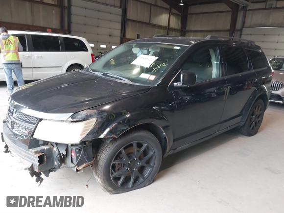2013 Dodge Journey SXT with VIN 3C4PDDBG0DT660956, listed as a IAAI auction lot 41593385 with 196,021 mi miles and . Bid and sale history available at DreamBid. Image 2.