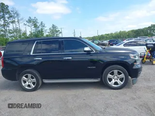 2015 Chevrolet Tahoe LT with VIN 1GNSCBKC1FR615817, listed as a IAAI auction lot 41760474 with 242,148 mi miles and . Bid and sale history available at DreamBid. Image 13.