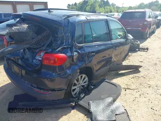 2015 Volkswagen Tiguan SE z VIN WVGBV7AX3FW583163, wystawiony jako IAAI lot #41991409 z przebiegiem 99 866 mil mil oraz . Historia ofert i sprzedaży dostępna na DreamBid. Obrazek 4.