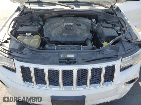 2015 Jeep Grand Cherokee Overland with VIN 1C4RJFCM4FC618516, listed as a Copart auction lot 58671455 with 221,550 mi miles and Clean title. Bid and sale history available at DreamBid. Image 12.