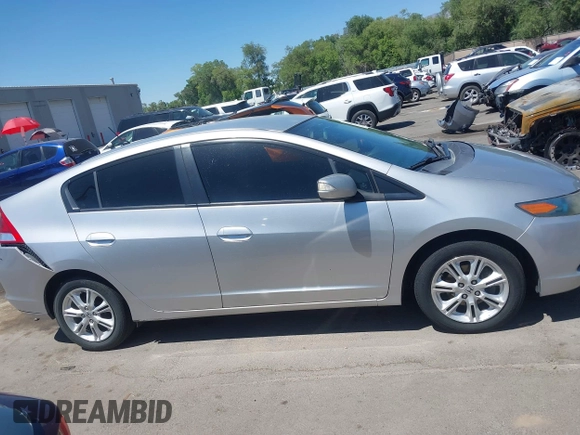 2010 Honda Insight EX with VIN JHMZE2H74AS041533, listed as a IAAI auction lot 42675766 with 203,357 mi miles and . Bid and sale history available at DreamBid. Image 13.