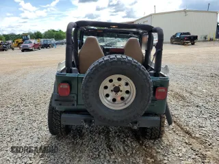 1999 Jeep Wrangler Sport with VIN 1J4FY19S0XP402688, listed as a Copart auction lot 58968125 with 211,910 mi miles and Salvage title. Bid and sale history available at DreamBid. Image 6.