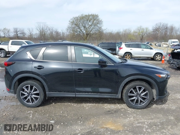 2018 Mazda CX-5 Touring with VIN JM3KFBCMXJ0438177, listed as a IAAI auction lot 42152275 with 65,434 mi miles and . Bid and sale history available at carsss.com. Image 13.