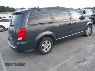 2012 Dodge Grand Caravan SXT with VIN 2C4RDGCG1CR141019, listed as a IAAI auction lot 42088541 with 148,931 mi miles and . Bid and sale history available at DreamBid. Image 4.