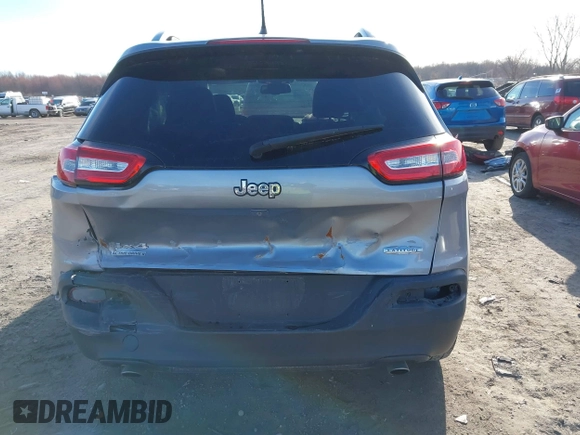 2014 Jeep Cherokee Latitude with VIN 1C4PJMCSXEW125737, listed as a IAAI auction lot 41863778 with 120,226 mi miles. Bid and sale history available at carsss.com. Image 16.