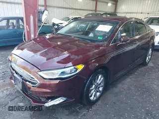 2017 Ford Fusion SE z VIN 3FA6P0HD2HR122650, wystawiony jako IAAI lot #41965411 z przebiegiem 107 227 mil mil oraz . Historia ofert i sprzedaży dostępna na DreamBid. Obrazek 2.