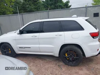 2021 Jeep Grand Cherokee Trackhawk with VIN 1C4RJFN95MC843131, listed as a IAAI auction lot 42688185 with 16,391 mi miles and . Bid and sale history available at DreamBid. Image 14.