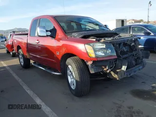 2004 Nissan Titan XE with VIN 1N6AA06A24N584067, listed as a IAAI auction lot 41568800 with 184,664 mi miles. Bid and sale history available at carsss.com. Image 1.