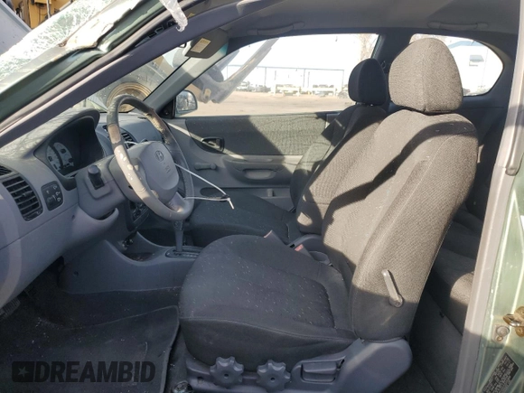 2003 Hyundai Accent GL with VIN KMHCG35CX3U242848, listed as a Copart auction lot 86558394 with 56,248 mi miles and Salvage Title. Bid and sale history available at carsss.com. Image 7.