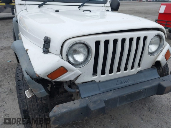 2006 Jeep Wrangler Sport Right Hand Drive with VIN 1J4F449S16P709895, listed as a IAAI auction lot 41349311 with 157,125 mi miles. Bid and sale history available at carsss.com. Image 18.