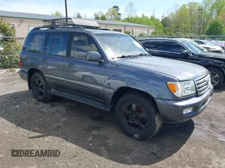 2003 Toyota Land Cruiser z VIN JTEHT05J932041288, wystawiony jako IAAI lot #42000615 z przebiegiem 166 159 mil mil oraz . Historia ofert i sprzedaży dostępna na DreamBid. Obrazek 1.