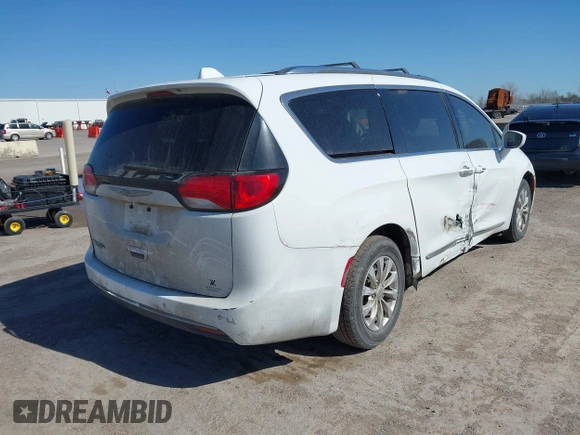 2018 Chrysler Pacifica Touring L with VIN 2C4RC1BG1JR119682, listed as a IAAI auction lot 41762362 with 167,380 mi miles and . Bid and sale history available at DreamBid. Image 4.
