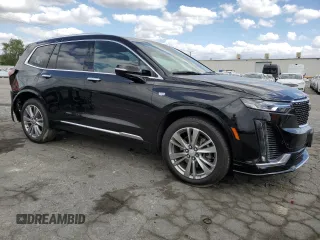 2023 Cadillac XT6 FWD Premium Luxury with VIN 1GYKPCRS5PZ220616, listed as a Copart auction lot 56913725 with 25,860 mi miles and Salvage title. Bid and sale history available at DreamBid. Image 4.