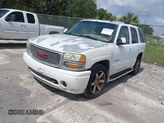 2004 GMC Yukon Denali z VIN 1GKEK63U44J302350, wystawiony jako IAAI lot #42458112 z przebiegiem 231 729 mil mil oraz . Historia ofert i sprzedaży dostępna na DreamBid. Obrazek 2.