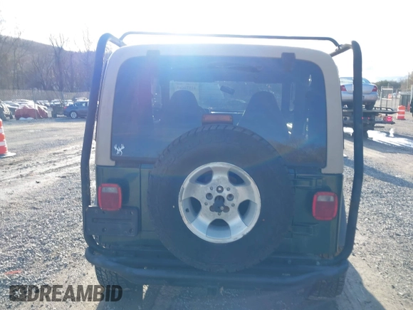 2000 Jeep Wrangler Sahara with VIN 1J4FA59S0YP724521, listed as a IAAI auction lot 41574689 with 167,584 mi miles. Bid and sale history available at carsss.com. Image 16.