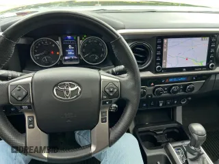 2022 Toyota Tacoma Limited with VIN 3TMGZ5AN7NM458988, listed as a Copart auction lot 65398105 with 32,115 mi miles and Salvage title. Bid and sale history available at DreamBid. Image 7.