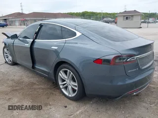 2013 Tesla Model S with VIN 5YJSA1CG9DFP27357, listed as a IAAI auction lot 42362514 with Not provided miles and . Bid and sale history available at DreamBid. Image 3.