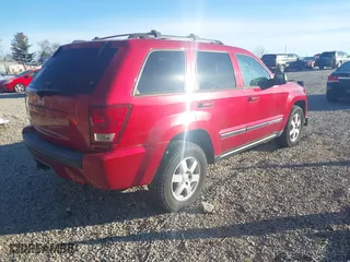 2010 Jeep Grand Cherokee Laredo with VIN 1J4PR4GK2AC135011, listed as a IAAI auction lot 41589996 with 111,536 mi miles. Bid and sale history available at carsss.com. Image 4.