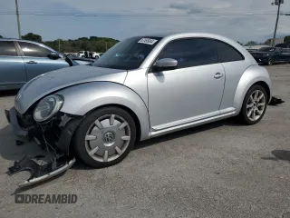 2012 Volkswagen Beetle 2.5L w/Sound/Nav PZEV with VIN 3VWJP7AT6CM647633, listed as a Copart auction lot 67655804 with 139,181 mi miles and Salvage Title. Bid and sale history available at DreamBid. Image 1.
