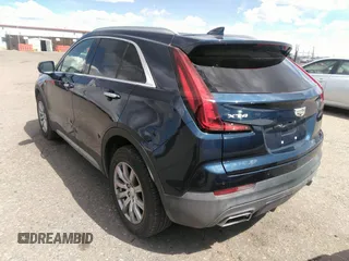 2021 Cadillac XT4 FWD Premium Luxury with VIN 1GYFZCR48MF004009, listed as a IAAI auction lot 41956723 with 82,483 mi miles. Bid and sale history available at carsss.com. Image 3.