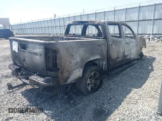2018 GMC Canyon 2WD SLE z VIN 1GTG5CEN2J1280716, wystawiony jako IAAI lot #42295776 z przebiegiem Nie podano mil oraz . Historia ofert i sprzedaży dostępna na DreamBid. Obrazek 4.