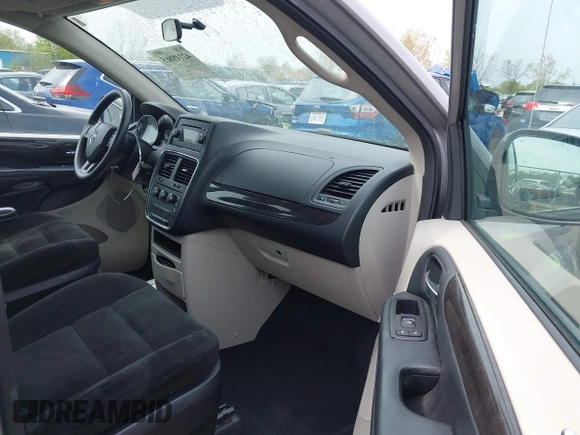 2016 Dodge Grand Caravan SE with VIN 2C4RDGBG5GR251689, listed as a IAAI auction lot 42149865 with 137,410 mi miles and . Bid and sale history available at DreamBid. Image 5.