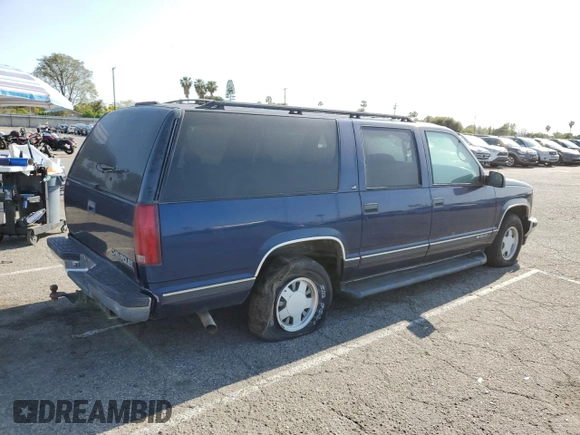 1999 Chevrolet Suburban with VIN 3GNEC16RXXG254126, listed as a Copart auction lot 52051405 with 113,554 mi miles and Clean title. Bid and sale history available at DreamBid. Image 3.