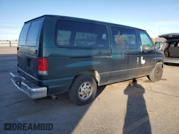 1999 Ford Econoline Passenger XL with VIN 1FMRE1126XHB41841, listed as a Copart auction lot 51338135 with 161,416 mi miles and Clean title. Bid and sale history available at DreamBid. Image 3.