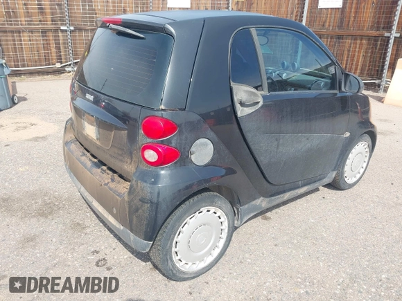 2009 Smart fortwo Pure z VIN WMEEJ31X59K312270, wystawiony jako IAAI lot #41910686 z przebiegiem 111 107 mil mil oraz . Historia ofert i sprzedaży dostępna na DreamBid. Obrazek 4.