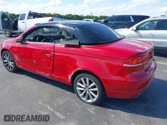 2013 Volkswagen Eos Komfort with VIN WVWBW8AH9DV008763, listed as a IAAI auction lot 41893700 with 53,766 mi miles and . Bid and sale history available at DreamBid. Image 3.