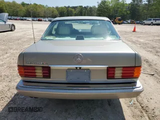1991 Mercedes-Benz 560 with VIN WDBCA39E9MA599487, listed as a Copart auction lot 51921915 with 59,132 mi miles and Salvage Title. Bid and sale history available at DreamBid. Image 6.