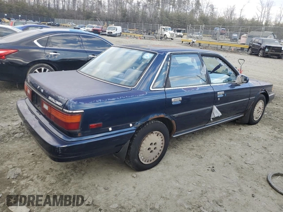 1989 Toyota Camry z VIN 4T1SV22E0KU032677, wystawiony jako Copart lot #46308555 z przebiegiem 993 896 mil mil oraz Czysty tytuł • Clean title. Historia ofert i sprzedaży dostępna na DreamBid. Obrazek 3.