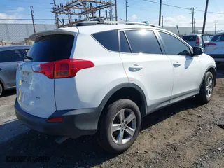 2015 Toyota RAV4 XLE with VIN JTMWFREV9FJ034992, listed as a IAAI auction lot 41922694 with 100,956 mi miles. Bid and sale history available at carsss.com. Image 4.