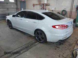 2019 Ford Fusion Titanium with VIN 3FA6P0D92KR153096, listed as a IAAI auction lot 41679393 with 127,292 mi miles and . Bid and sale history available at DreamBid. Image 3.