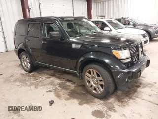 2011 Dodge Nitro Heat with VIN 1D4PU4GX0BW517654, listed as a IAAI auction lot 41715627 with 107,954 mi miles. Bid and sale history available at carsss.com. Image 1.