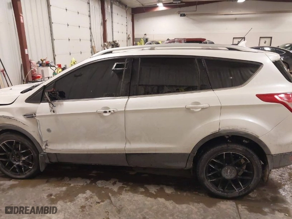 2014 Ford Escape Titanium with VIN 1FMCU9J9XEUE37566, listed as a IAAI auction lot 41412152 with 137,108 mi miles. Bid and sale history available at carsss.com. Image 14.