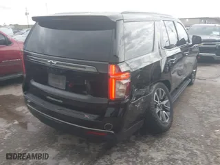 2021 Chevrolet Tahoe Z71 with VIN 1GNSKPKD5MR155986, listed as a IAAI auction lot 41870554 with 91,568 mi miles. Bid and sale history available at carsss.com. Image 4.