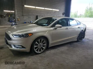 2017 Ford Fusion Titanium z VIN 3FA6P0K96HR132389, wystawiony jako Copart lot #57312665 z przebiegiem Nie podano mil oraz Szkoda całkowita • Salvage title. Historia ofert i sprzedaży dostępna na DreamBid. Obrazek 1.