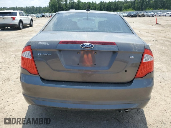2012 Ford Fusion SE z VIN 3FAHP0HA0CR328833, wystawiony jako Copart lot #57631955 z przebiegiem 94 613 mil mil oraz Szkoda całkowita • Salvage title. Historia ofert i sprzedaży dostępna na DreamBid. Obrazek 6.