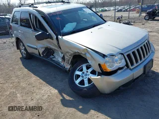 2008 Jeep Grand Cherokee Laredo with VIN 1J8GR48K28C169859, listed as a IAAI auction lot 41965149 with 166,069 mi miles. Bid and sale history available at carsss.com. Image 6.