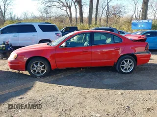 2004 Pontiac Grand Am SE2 with VIN 1G2NG52E84M672446, listed as a IAAI auction lot 40834541 with 209,231 mi miles. Bid and sale history available at carsss.com. Image 14.