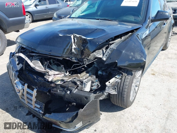2012 Cadillac CTS Performance z VIN 1G6DJ5E30C0156576, wystawiony jako IAAI lot #42287858 z przebiegiem 106 497 mil mil oraz . Historia ofert i sprzedaży dostępna na DreamBid. Obrazek 6.