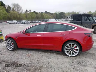 2018 Tesla Model 3 Long Range Battery with VIN 5YJ3E1EB7JF055384, listed as a IAAI auction lot 41924325 with 52,039 mi miles and . Bid and sale history available at DreamBid. Image 13.