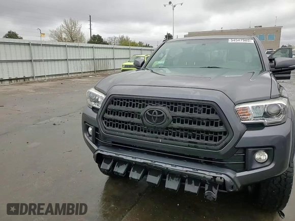 2017 Toyota Tacoma SR5 z VIN 3TMDZ5BN1HM030372, wystawiony jako Copart lot #54547985 z przebiegiem 67 663 mil mil oraz Szkoda całkowita • Salvage title. Historia ofert i sprzedaży dostępna na DreamBid. Obrazek 13.