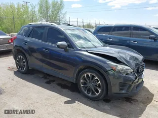 2016 Mazda CX-5 Grand Touring with VIN JM3KE4DY7G0643643, listed as a IAAI auction lot 42077497 with 120,343 mi miles. Bid and sale history available at carsss.com. Image 13.