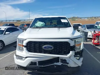 2021 Ford F-150 XL with VIN 1FTEW1CP2MKE42968, listed as a IAAI auction lot 42022454 with 32,908 mi miles. Bid and sale history available at carsss.com. Image 12.